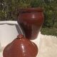 Large glazed terracotta jar, cognac colour with its lid.