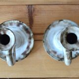 Duo of sandstone candlesticks