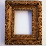 Golden frame in the Bérain Louis XIV style