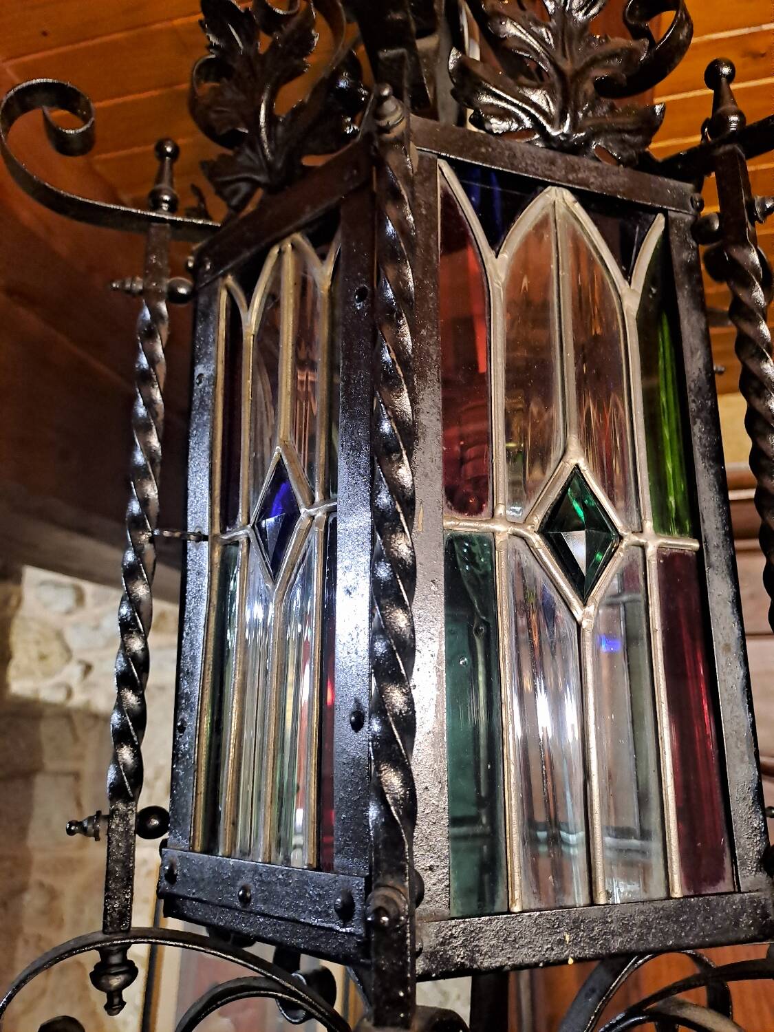 Wrought iron lantern with colored stained glass