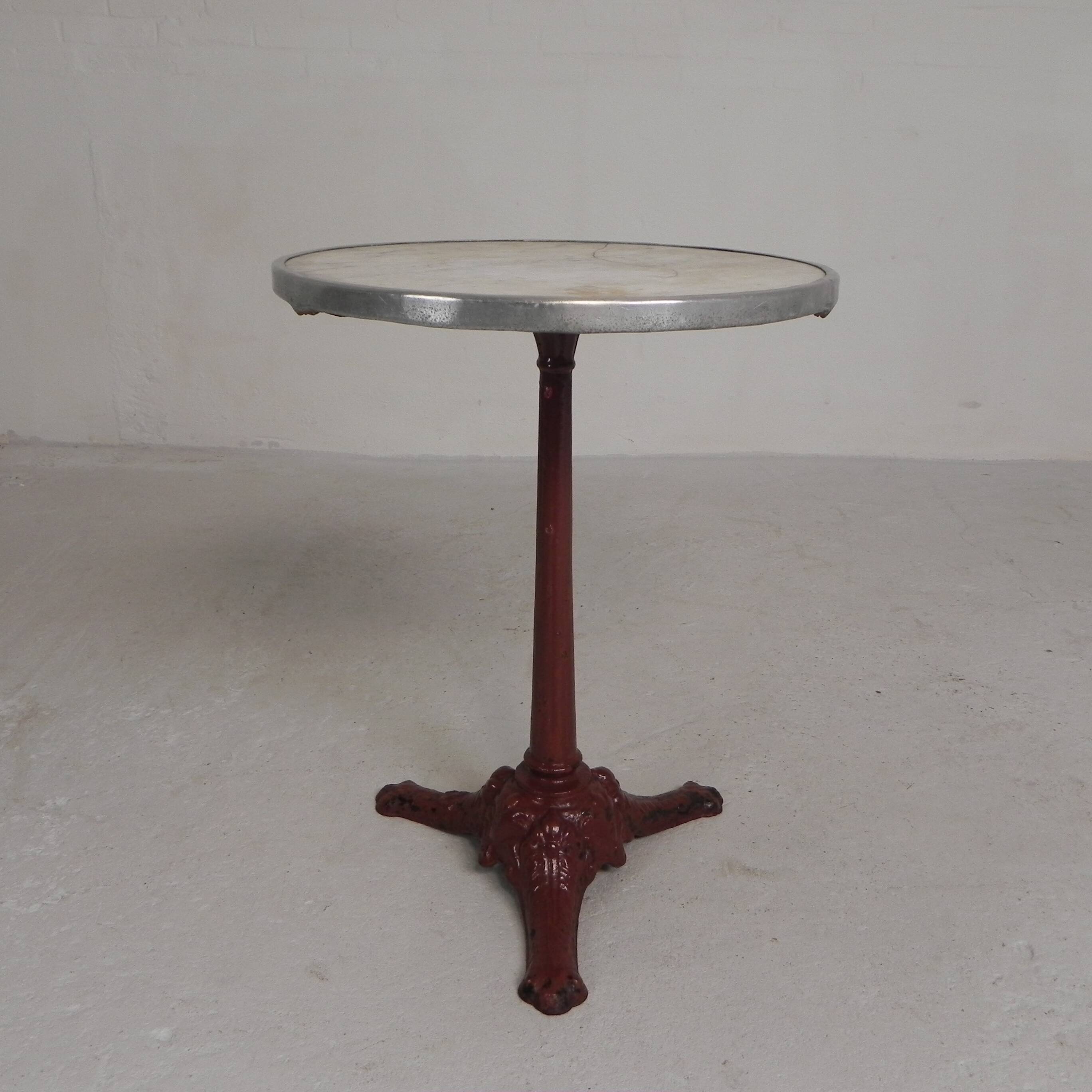 Bistro table with cast iron legs and marble top, 1920s.