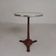 Bistro table with cast iron legs and marble top, 1920s.