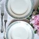 Mismatched antique flat plates made of ironstone accompanied by