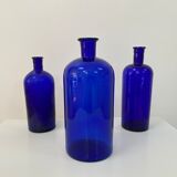 Trio of apothecary bottles in cobalt blue glass