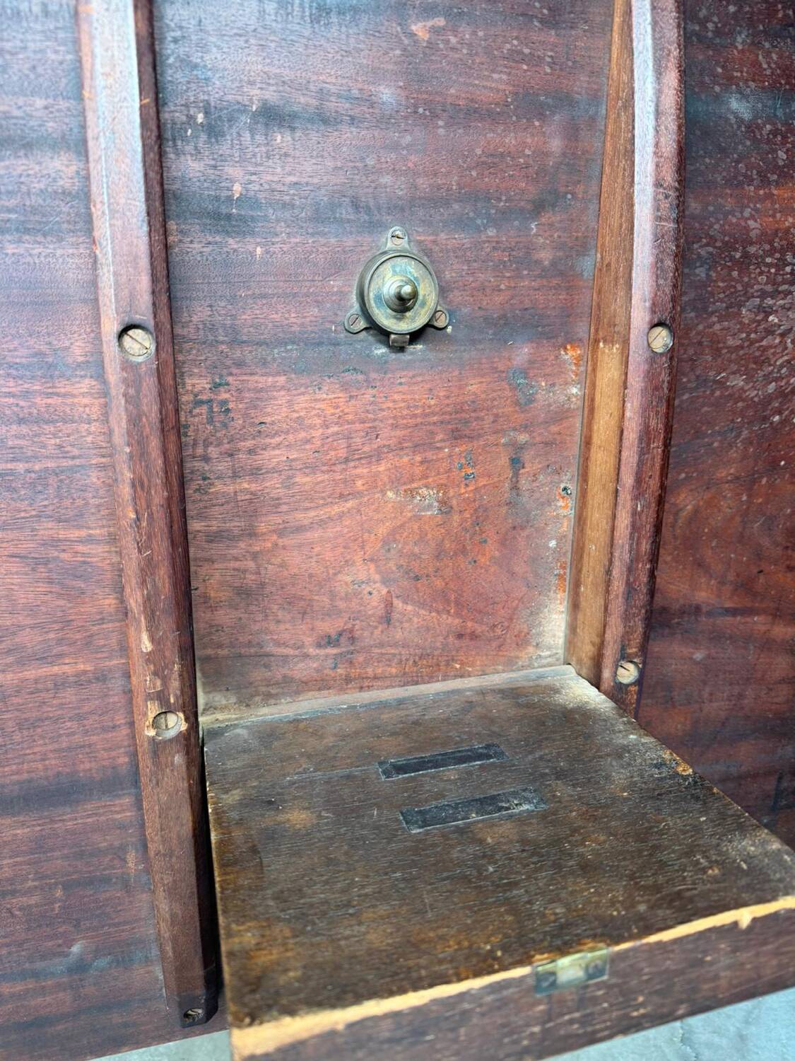 19th-century solid mahogany tilting table with a brass mechanism.
