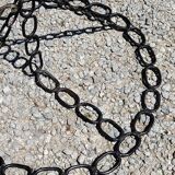 Vintage floor lamp from the 50s in blackened iron in the shape of a chain