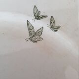 White and green ceramic dish decorated with flowers and butterflies