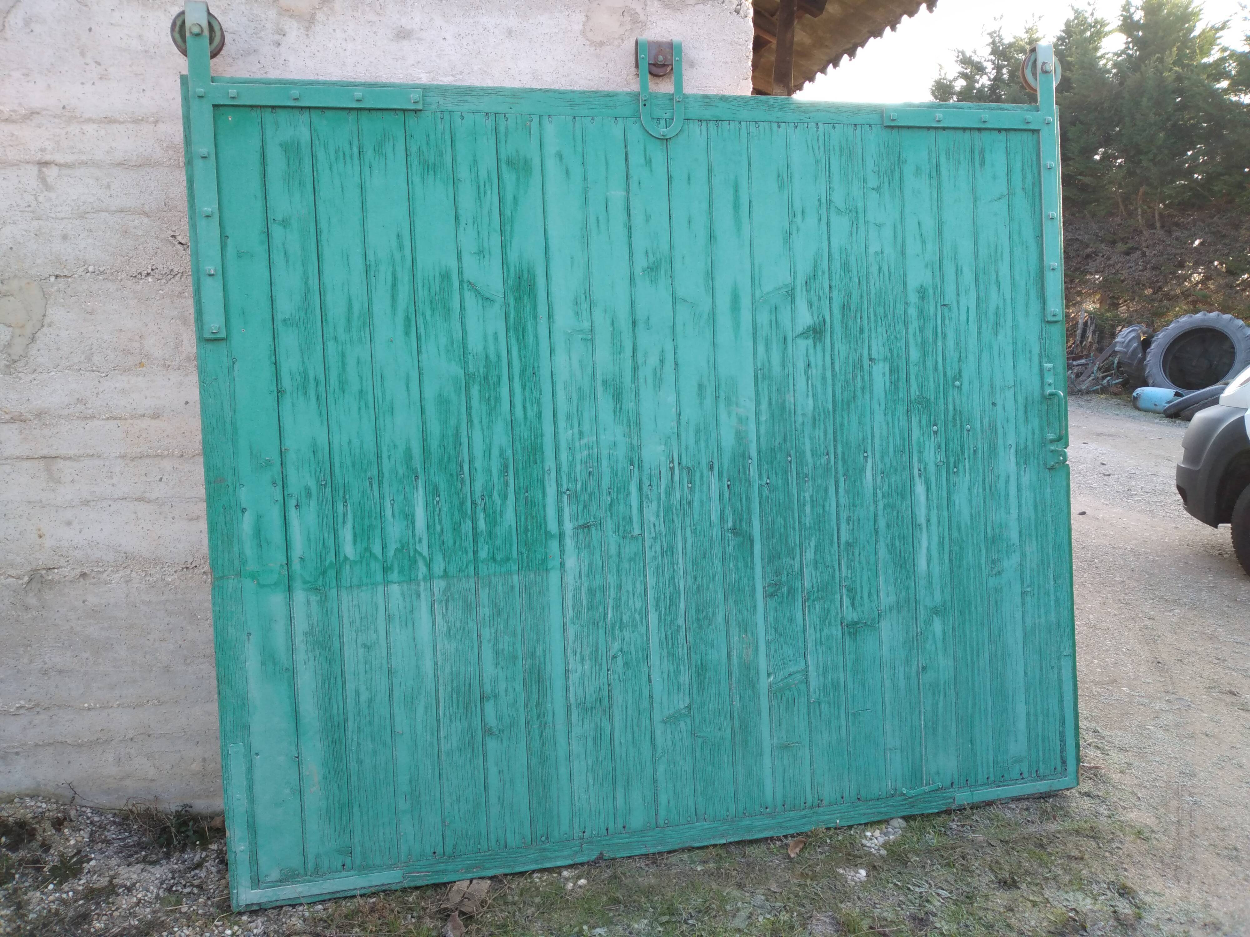 Old wooden door with pulley