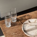 Tray, circular dish or plate made of white striped grey petrified wood.