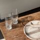 Tray, circular dish or plate made of white striped grey petrified wood.