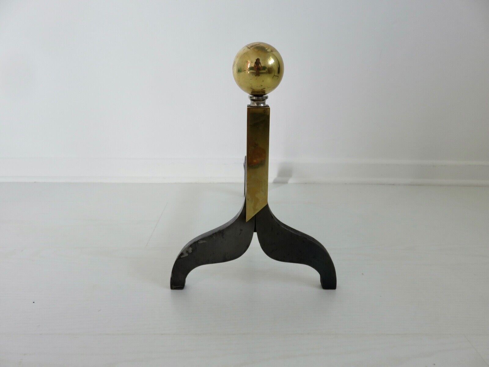 Pair of modernist steel and brass andirons