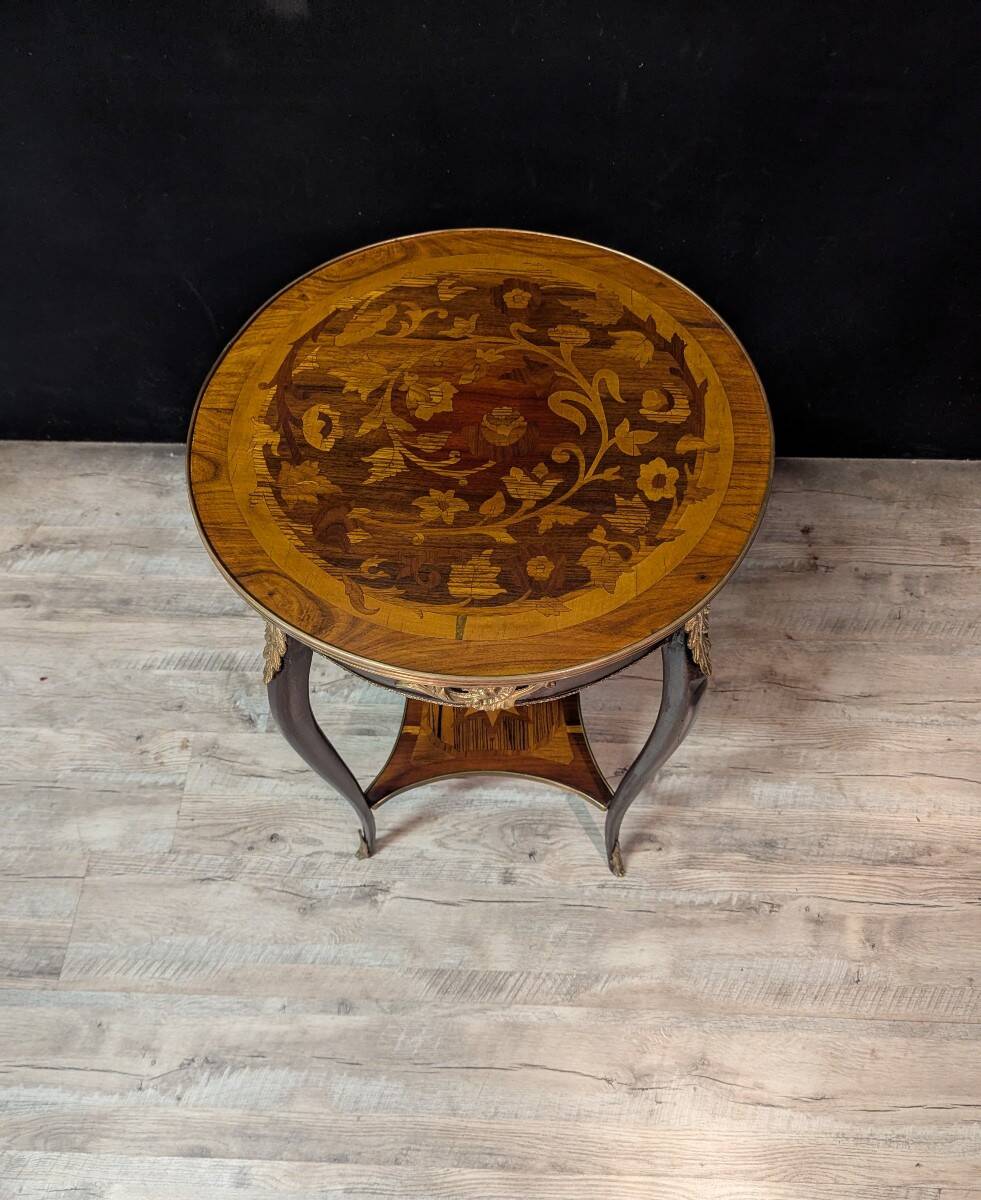 Louis XV style gueridon with floral marquetry.