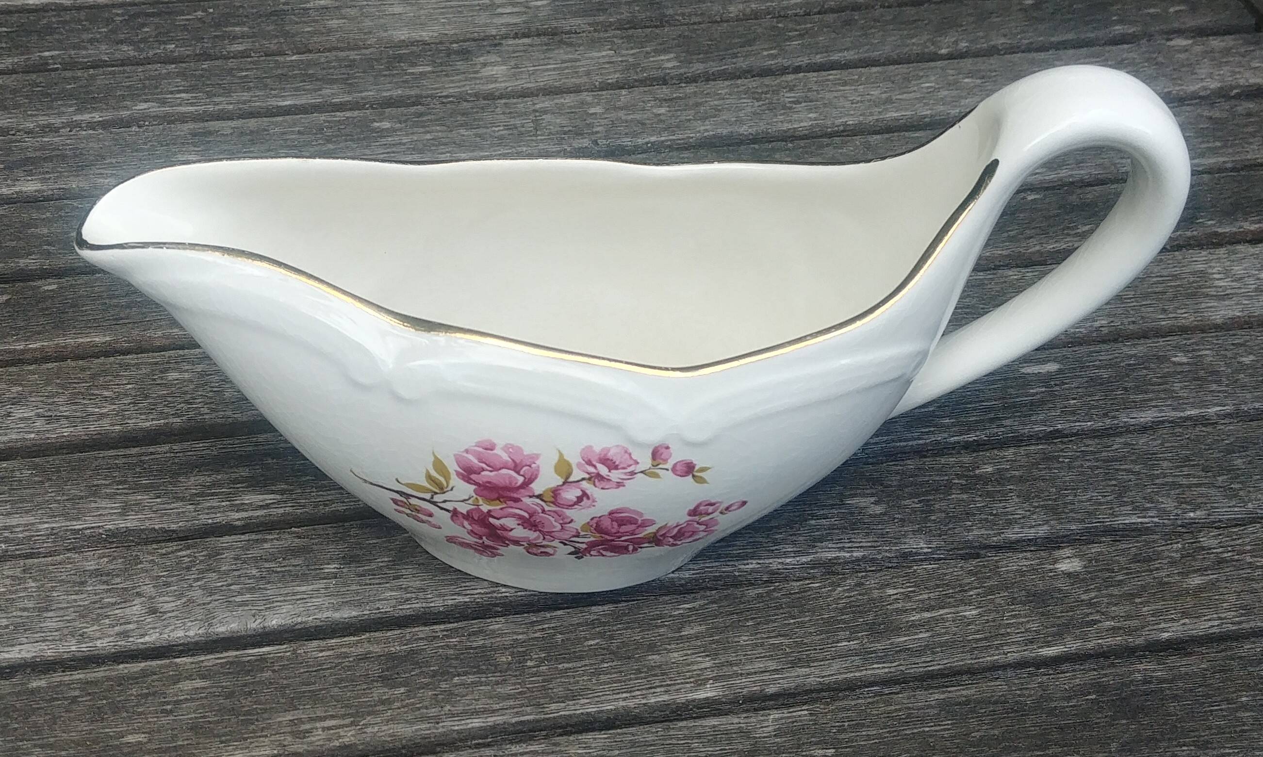 Porcelain saucière of the Gien earthenware factory model "peach blossoms"