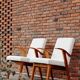 Fauteuil en bois et tissu bouclette beige clair restauré, design Puchala 1970