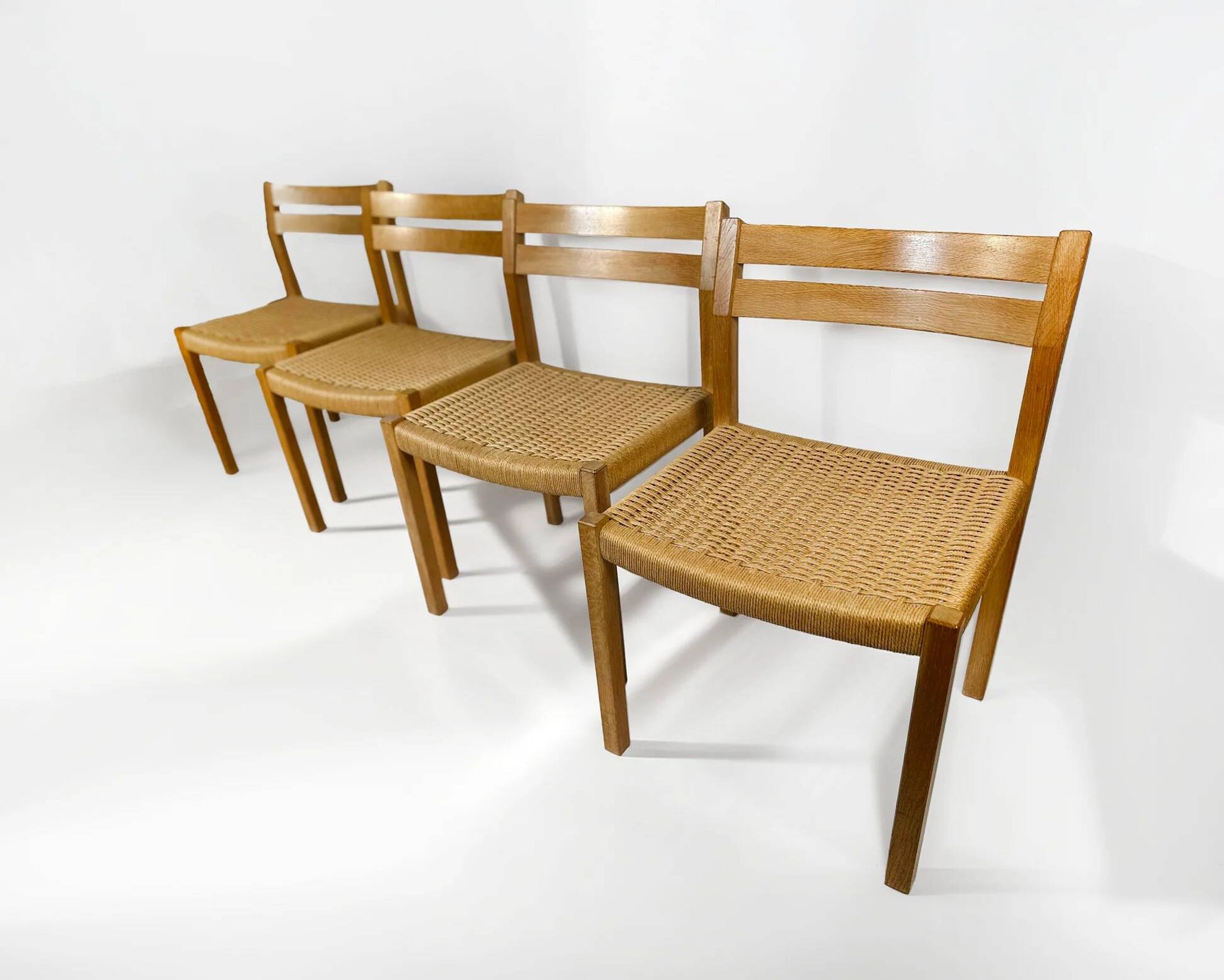 Dining chairs J.H. Møller model 401 in oak with original Danish cord — Denmark, 1970s