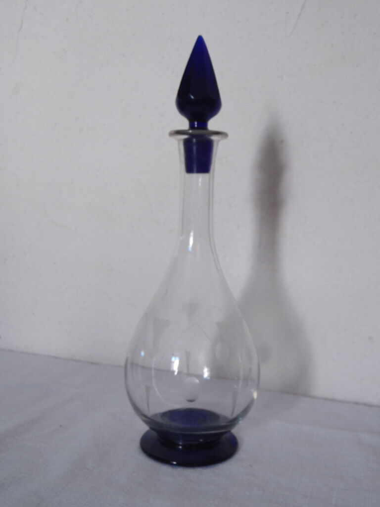 Small carafe with transparent cut glass liqueur and cobalt blue