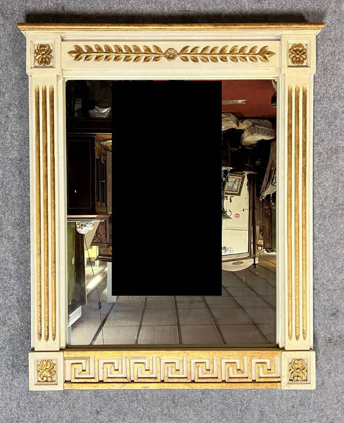 D'après Versace : miroir style Consulat en bois laqué et doré