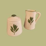 White ceramic pot and mini pitcher with bay leaf illustration