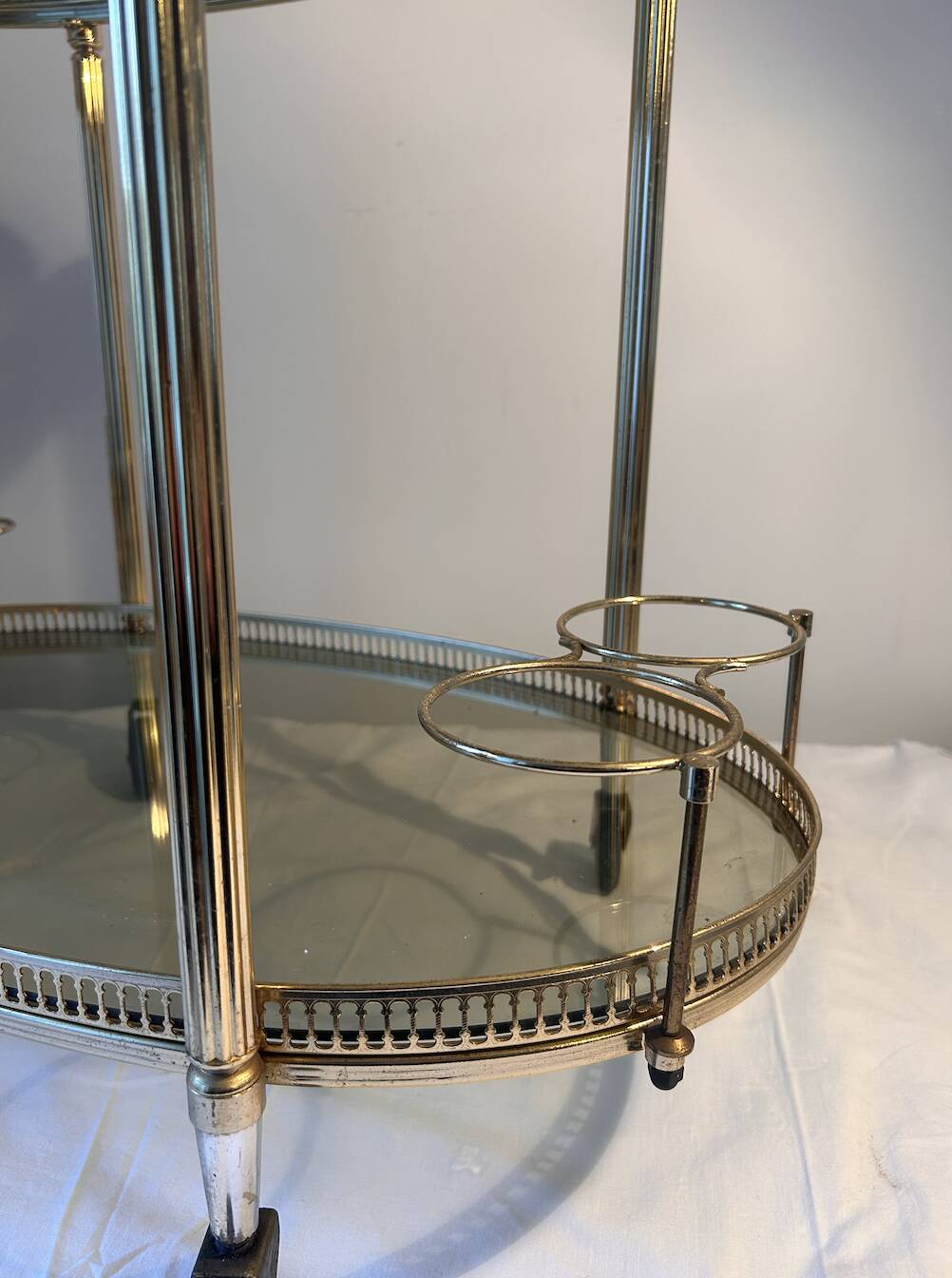 Neoclassical bar cart in gilded brass and smoked glass