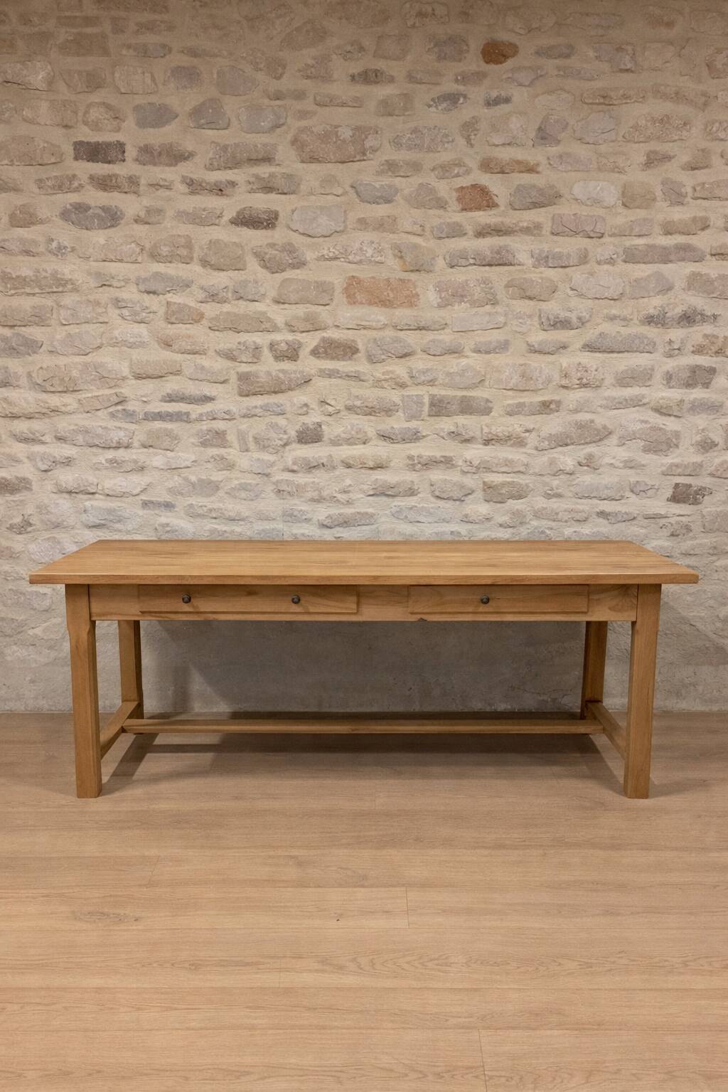 Large solid wood table with a sleek design – integrated storage.