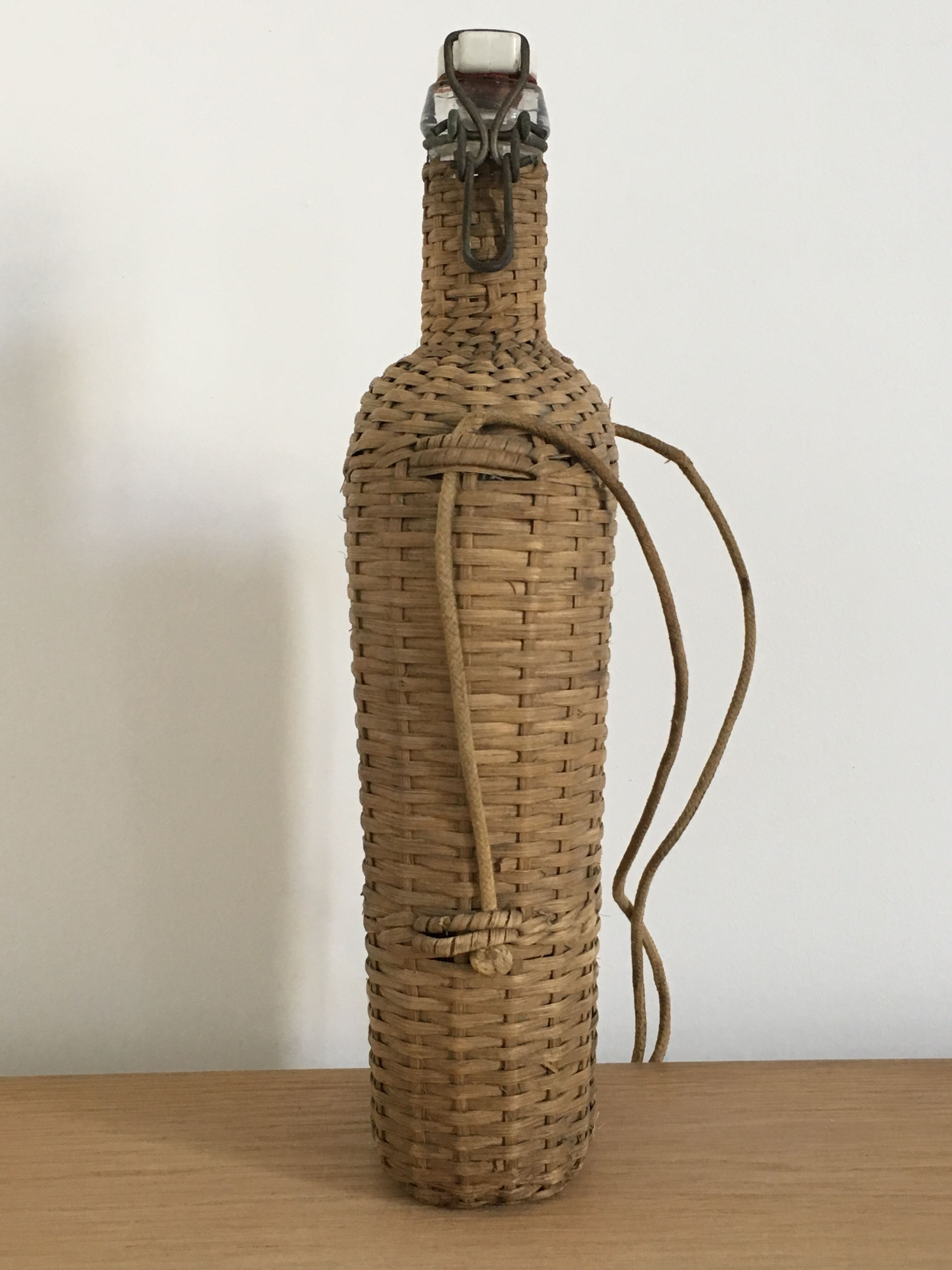 Glass bottle and wicker