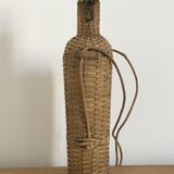 Glass bottle and wicker