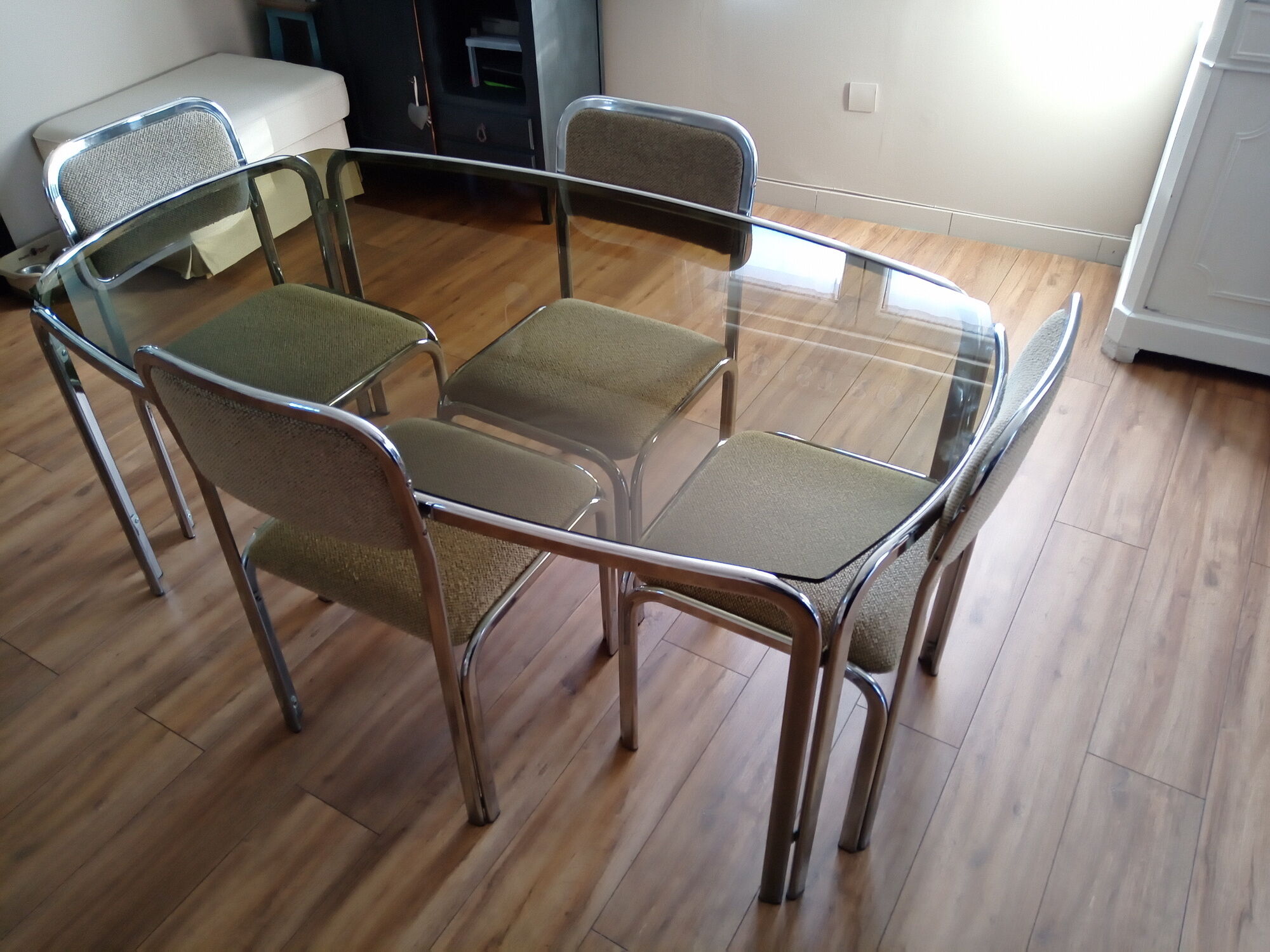 Table and 4 70s chairs chrome base and smoked glass tray chairs green water fabric