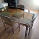Table and 4 70s chairs chrome base and smoked glass tray chairs green water fabric