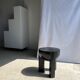 Black mango wood tripod side table with a semi-spherical top, height: 45 cm, diameter: 44 cm.