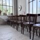 Set of 14 walnut bistro chairs.
