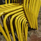 Lot of 11 yellow metallic bistro chairs from the 1950s
