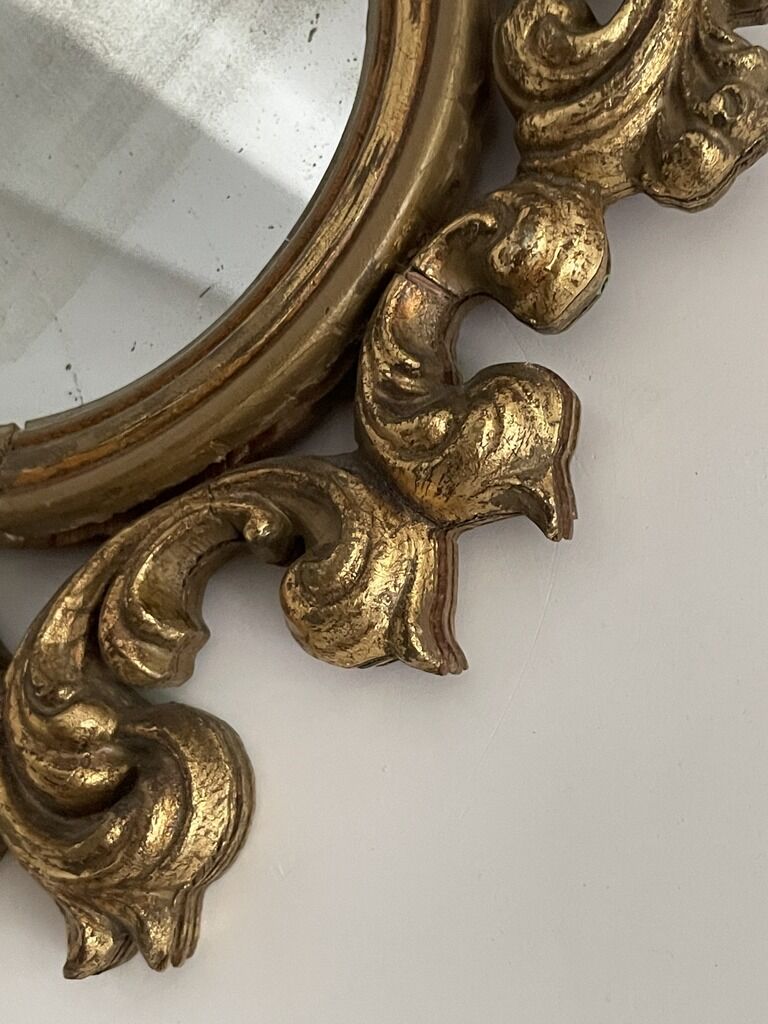 Old mirror in gilded wood
