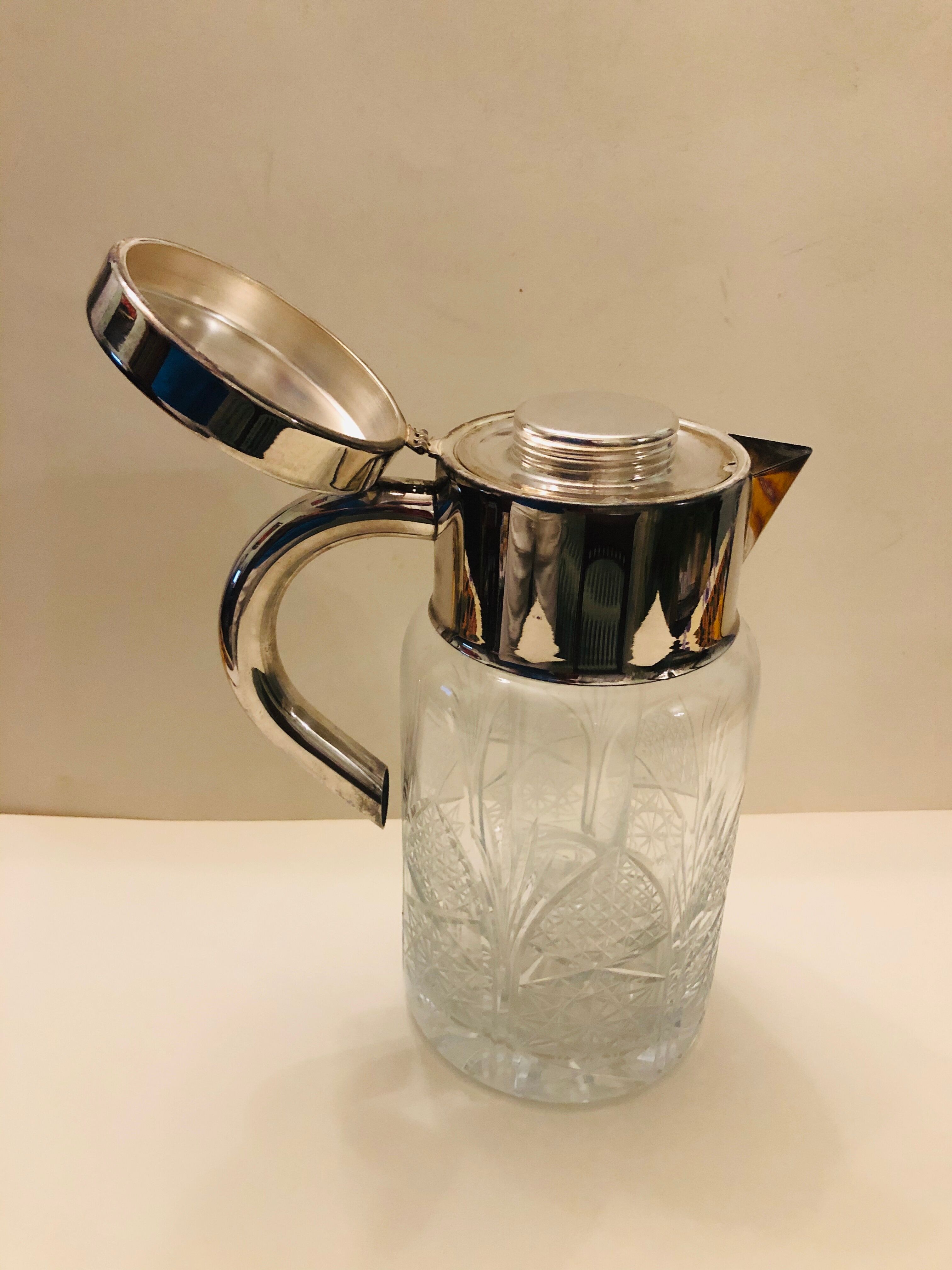 Refrigerant pitcher made of crystal and silver metal