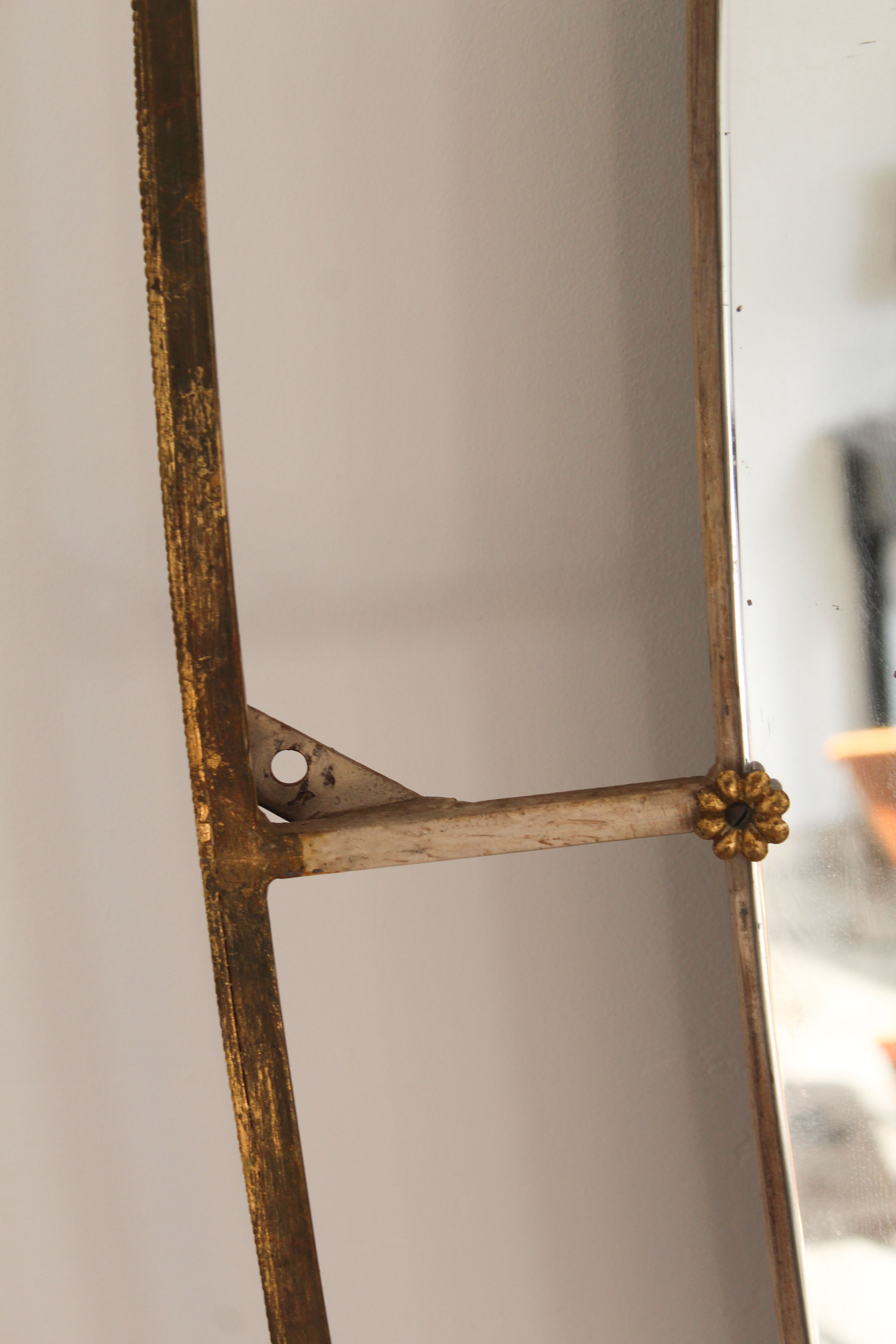 Oval mirror in art deco brass, Italy 1940s.