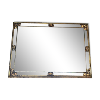 Rectangular mirror with beveled beads in original gold-tinted wood.