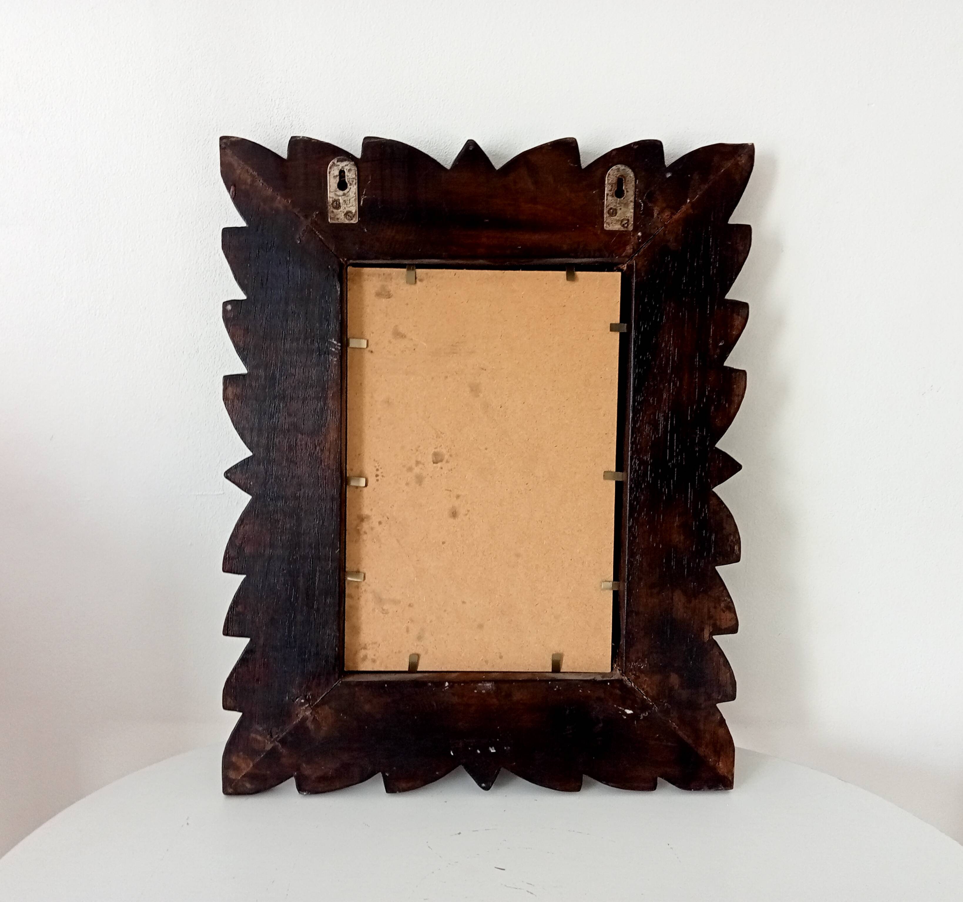 Antique mirror in carved wood