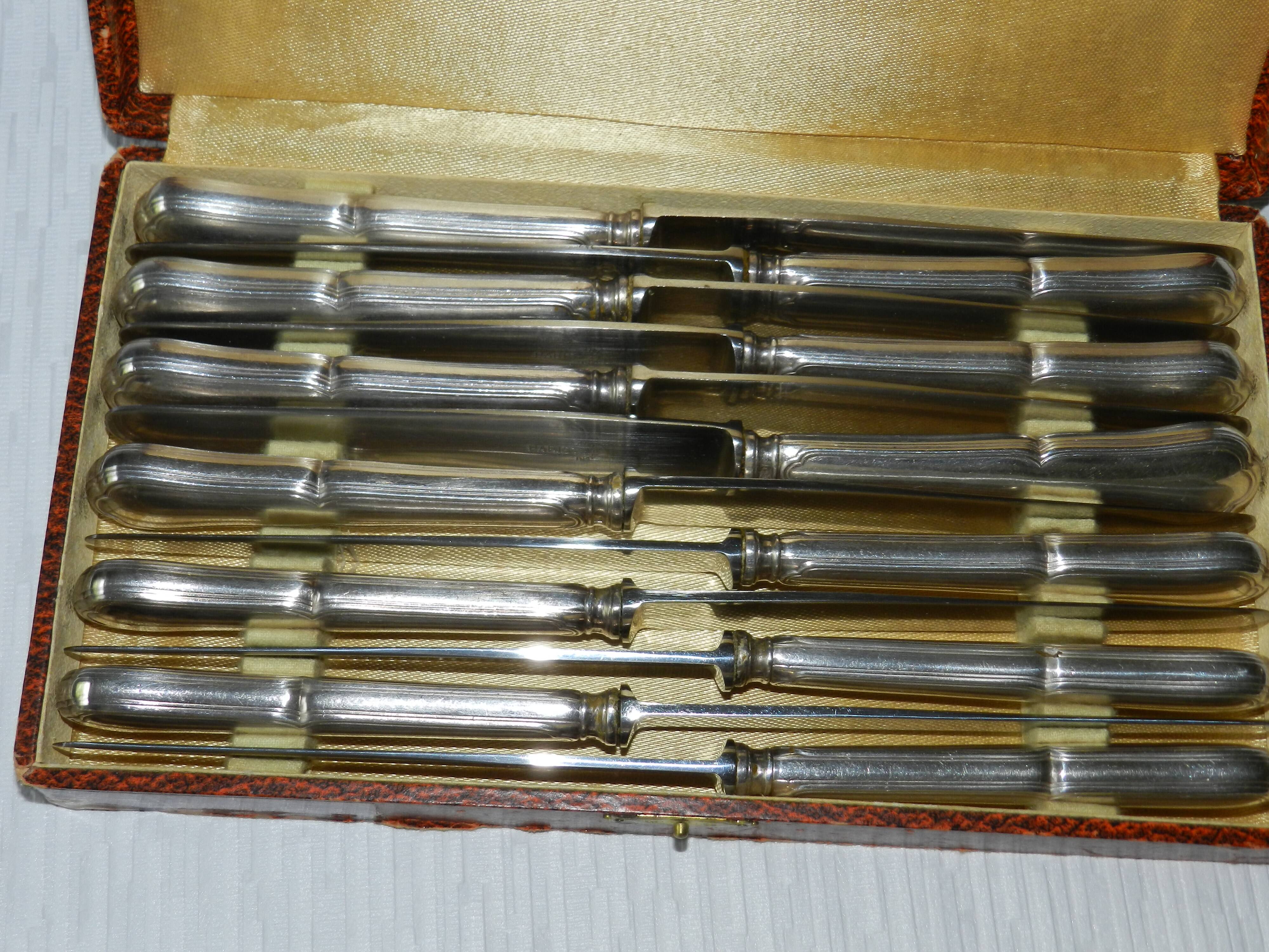 Set of 12 silver-plated metal knives
