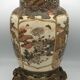 Old satsuma ceramic vase with various decorations mounted on bronze