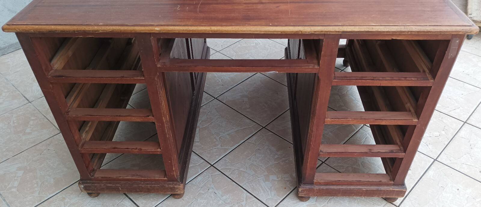 Vintage double-sided mahogany desk with 18 drawers.