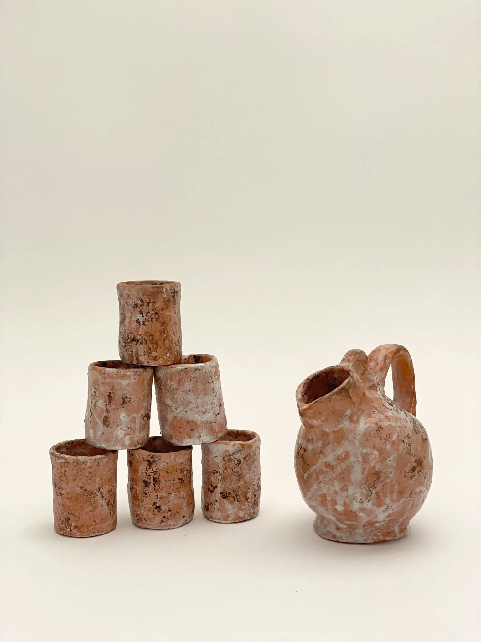 Clay jug and cups