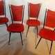 Série de 4 chaises 1950 skaï rouge pieds métal compas