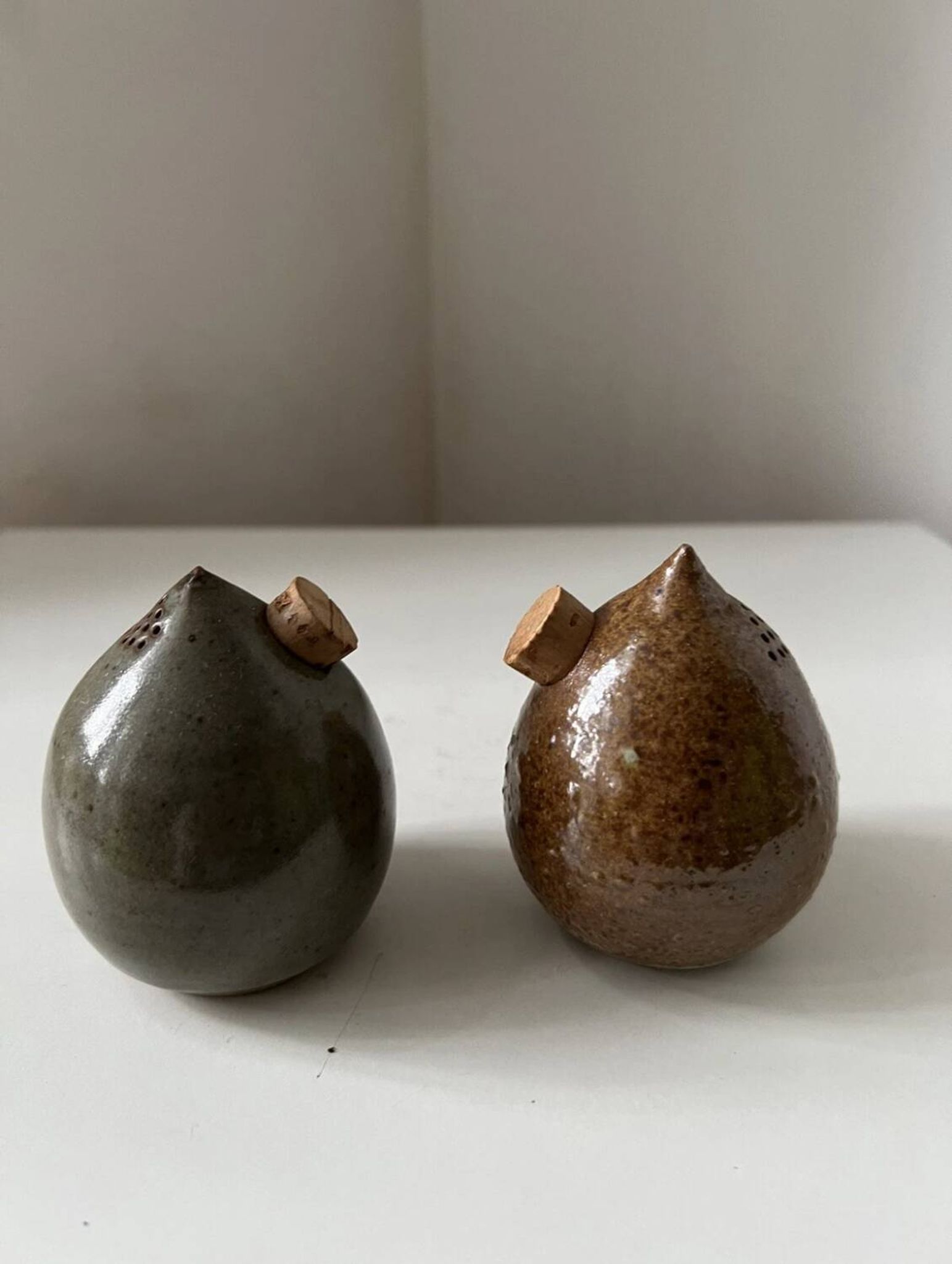 Pair of vintage round stoneware salt and pepper shakers
