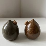 Pair of vintage round stoneware salt and pepper shakers