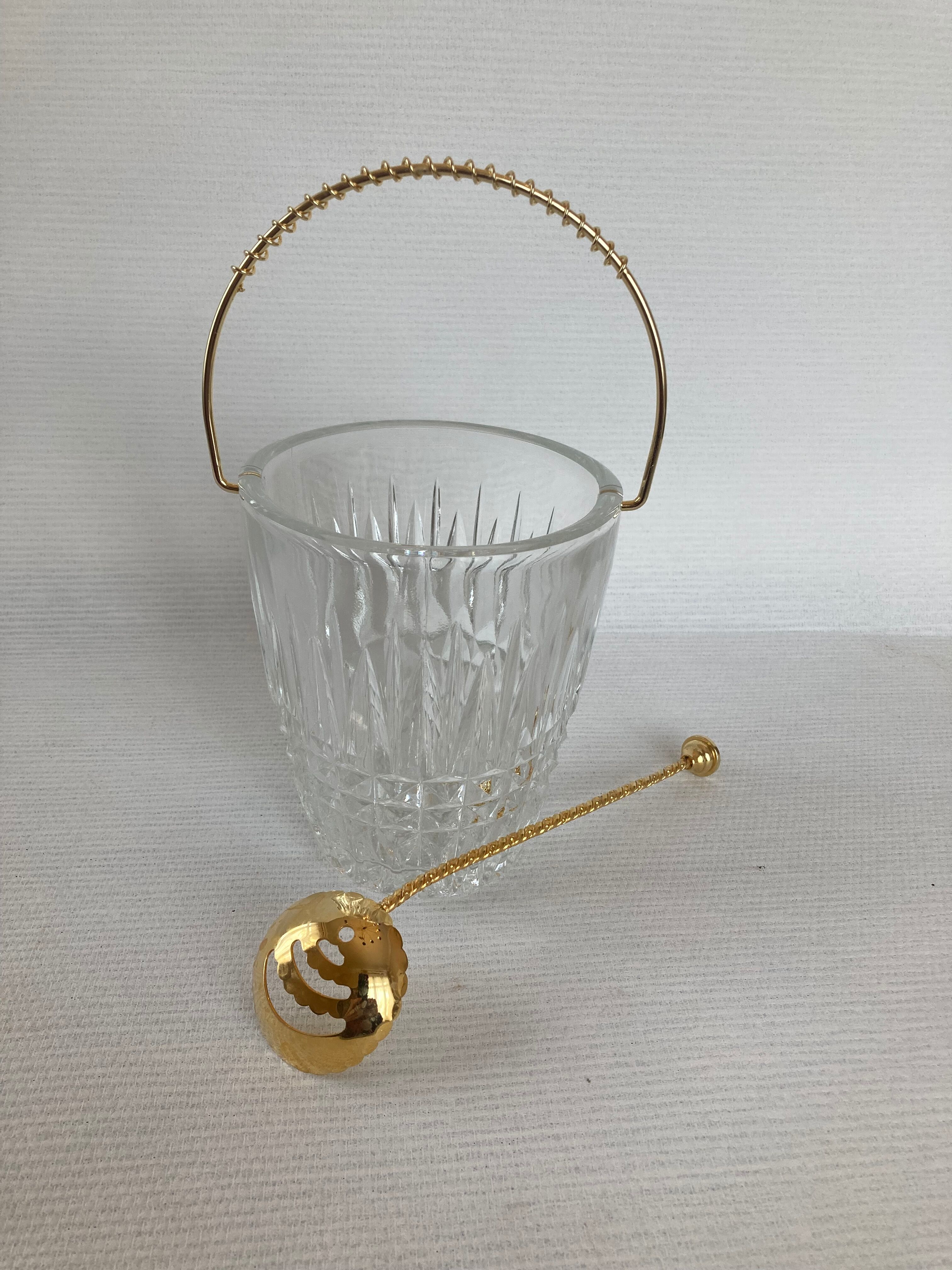Glass ice bucket and spoon