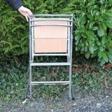 Retractable folding chair