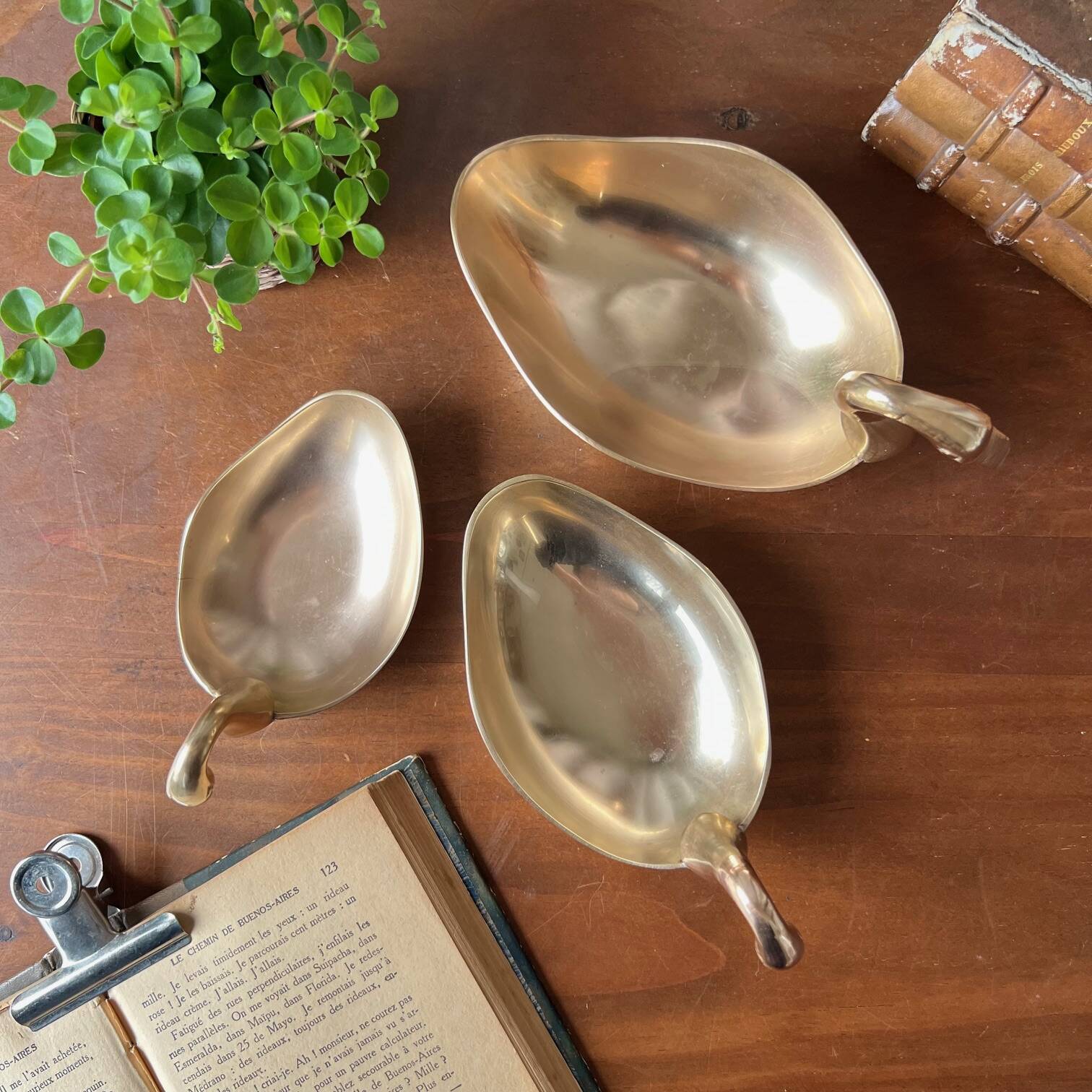 Trio of “swan” cups in gilded brass