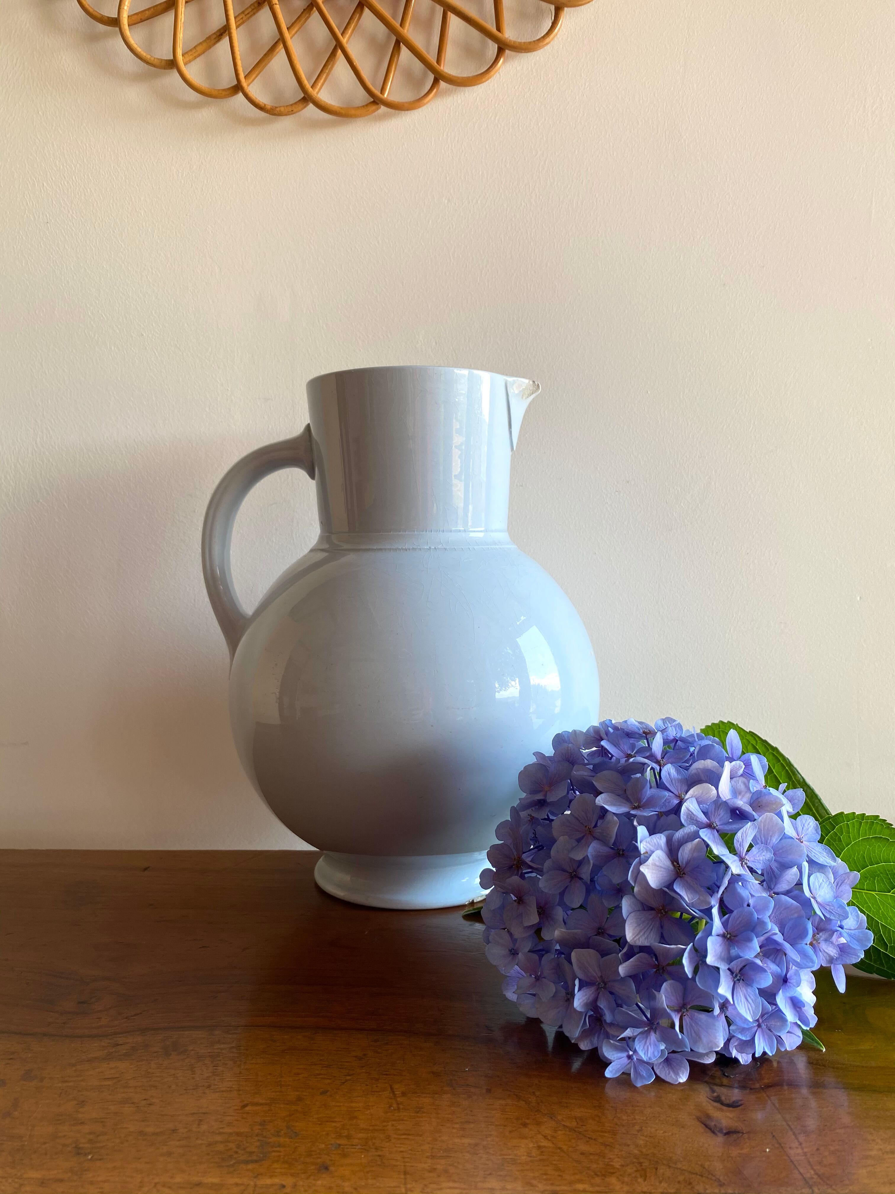 Antique vase in pale blue ceramic