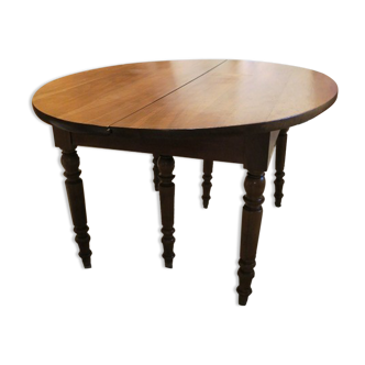 Oval walnut table with 5 extensions