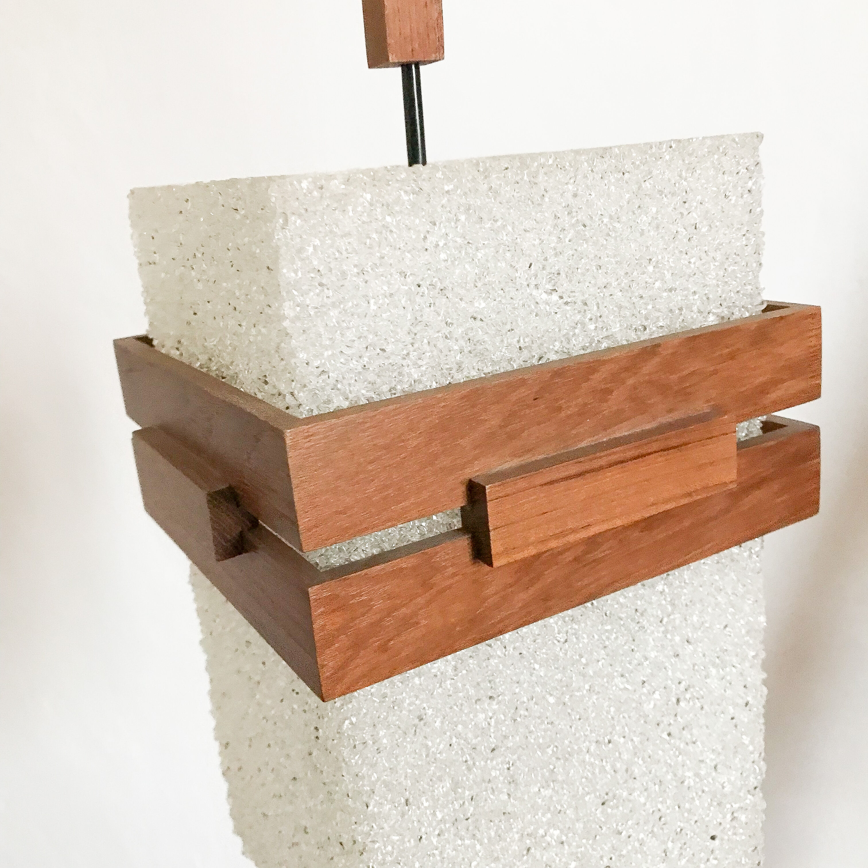 Suspension in perspex and teak