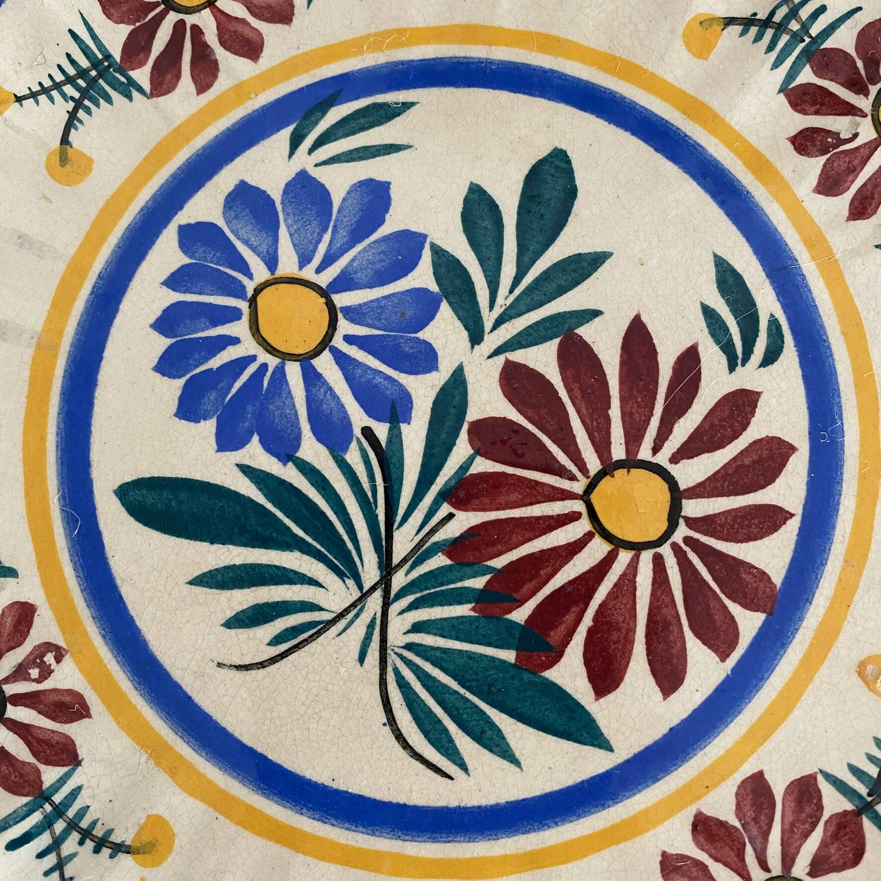 Henriot Quimper dessert plates, hand-painted earthenware.